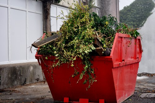 Photograph of a disposal area showing sorted waste and recycling bins